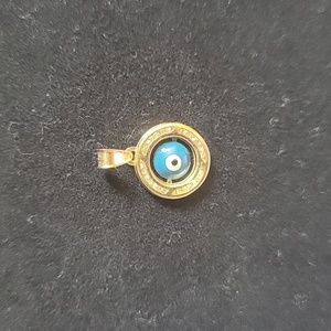 New, pendent 14k stamped eye in the middle